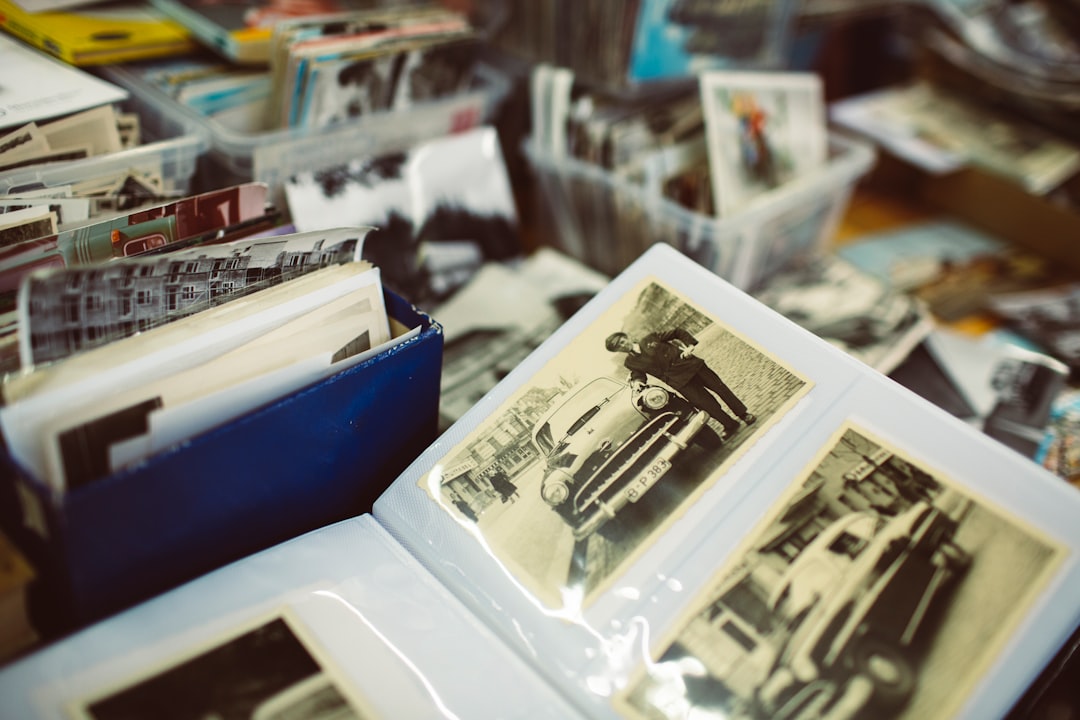 hero-img-02 Vintage analog classic photo album with old cars